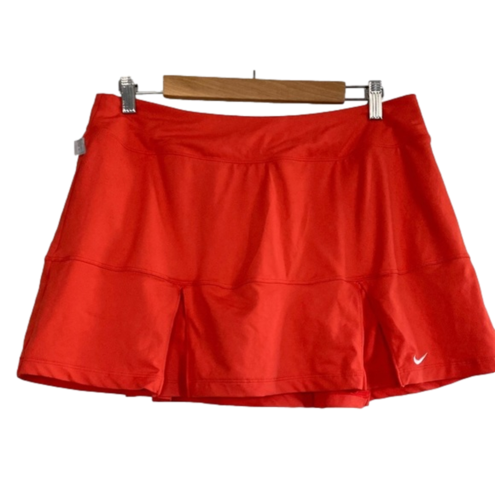 Nike dri-fit pleated orange tennis skort. Size L 32 inch waist
